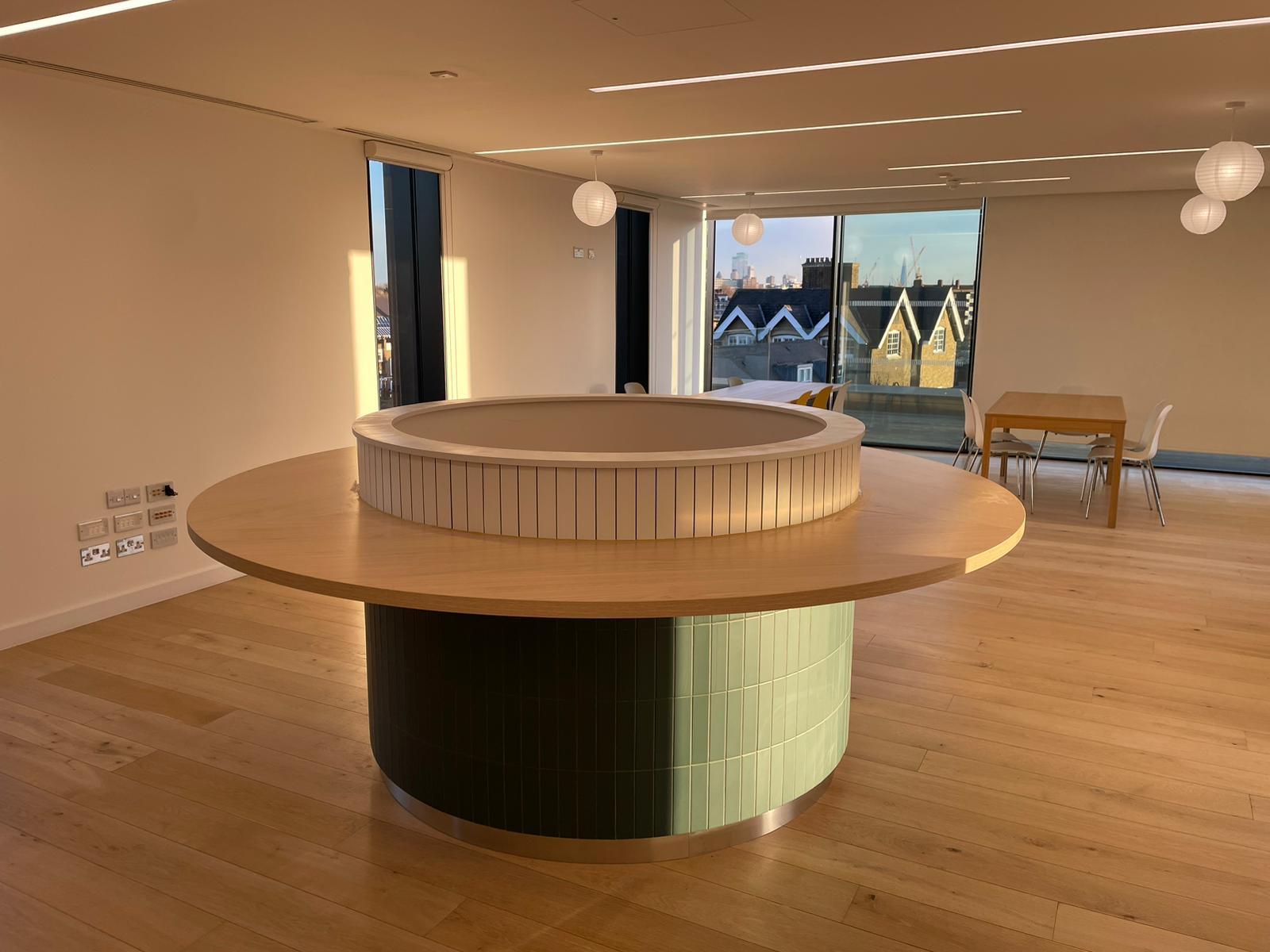 Large circular architectural feature table manufactured by Kustom Made