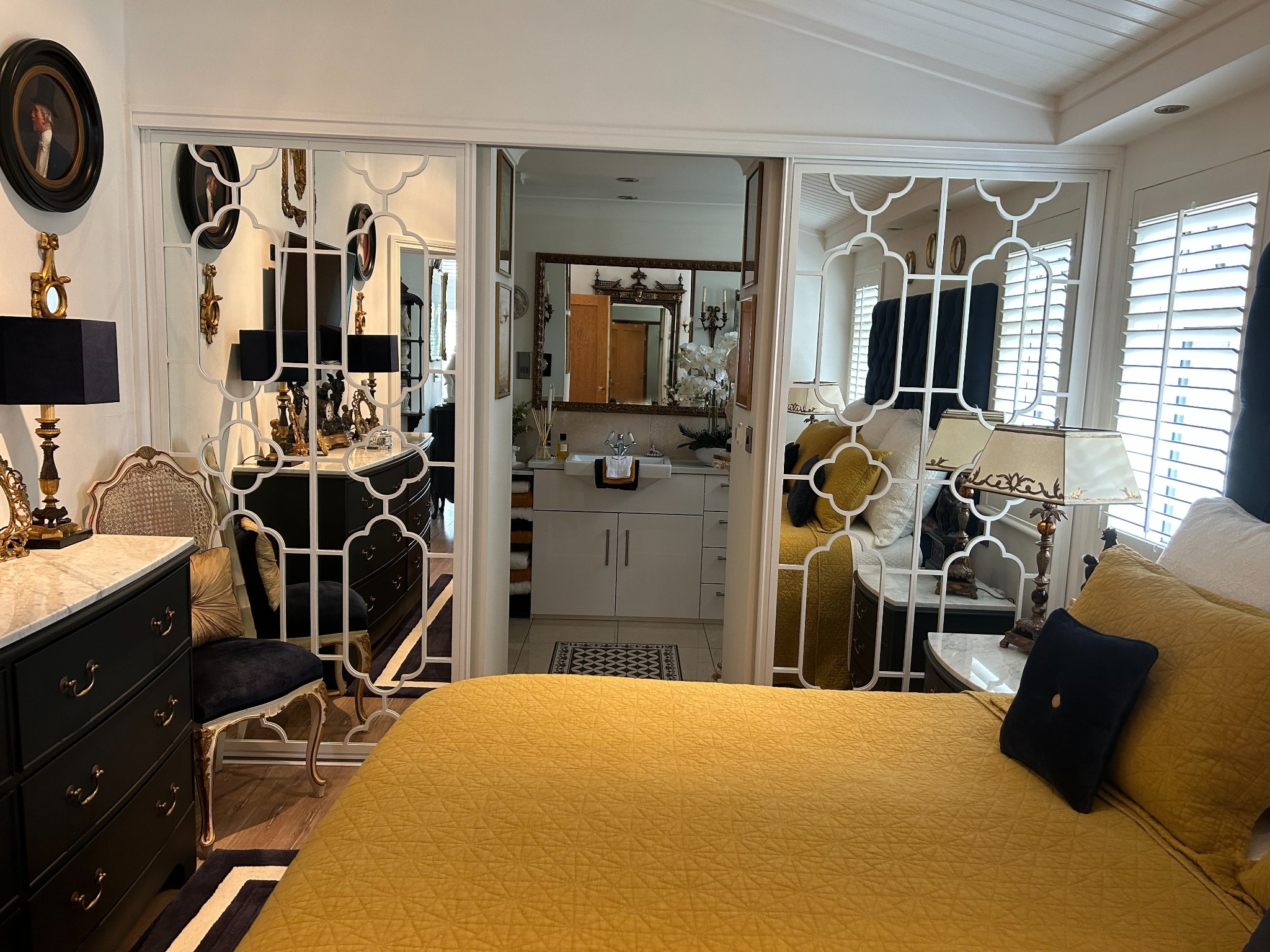 Decorative mirrored bedroom screens in a private residence