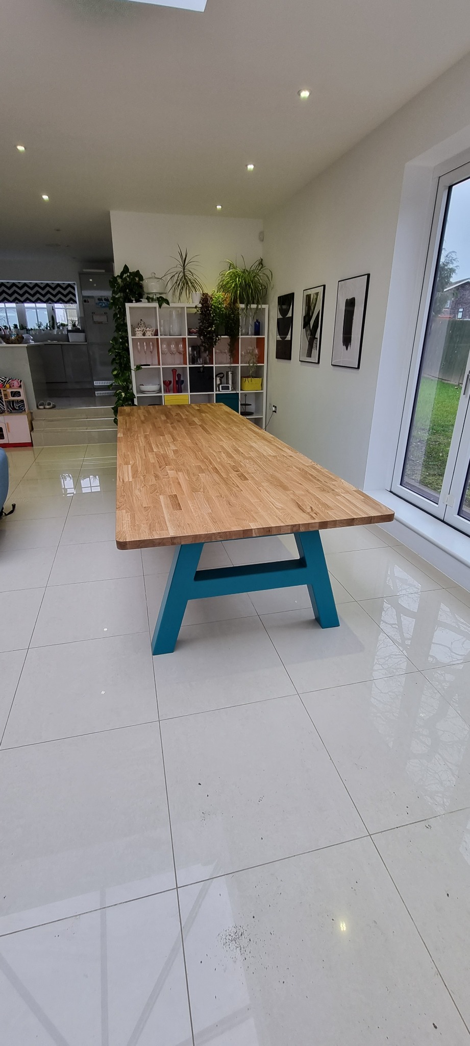 Long bespoke solid oak dining table with contemporary painted legs