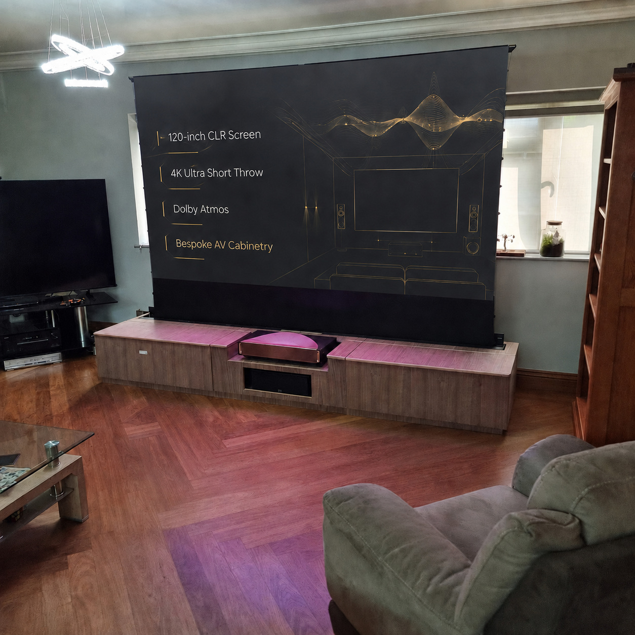 Celexon 120-inch floor-rising cinema screen operating above a bespoke walnut AV cabinet