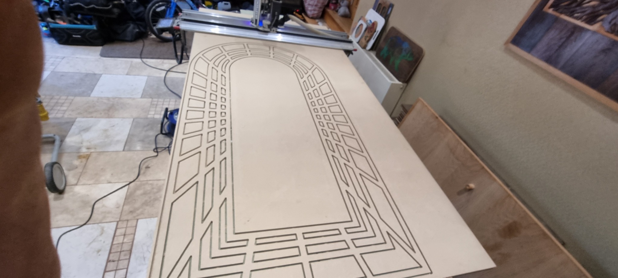 Geometric decorative routing in a panel on the workshop bench