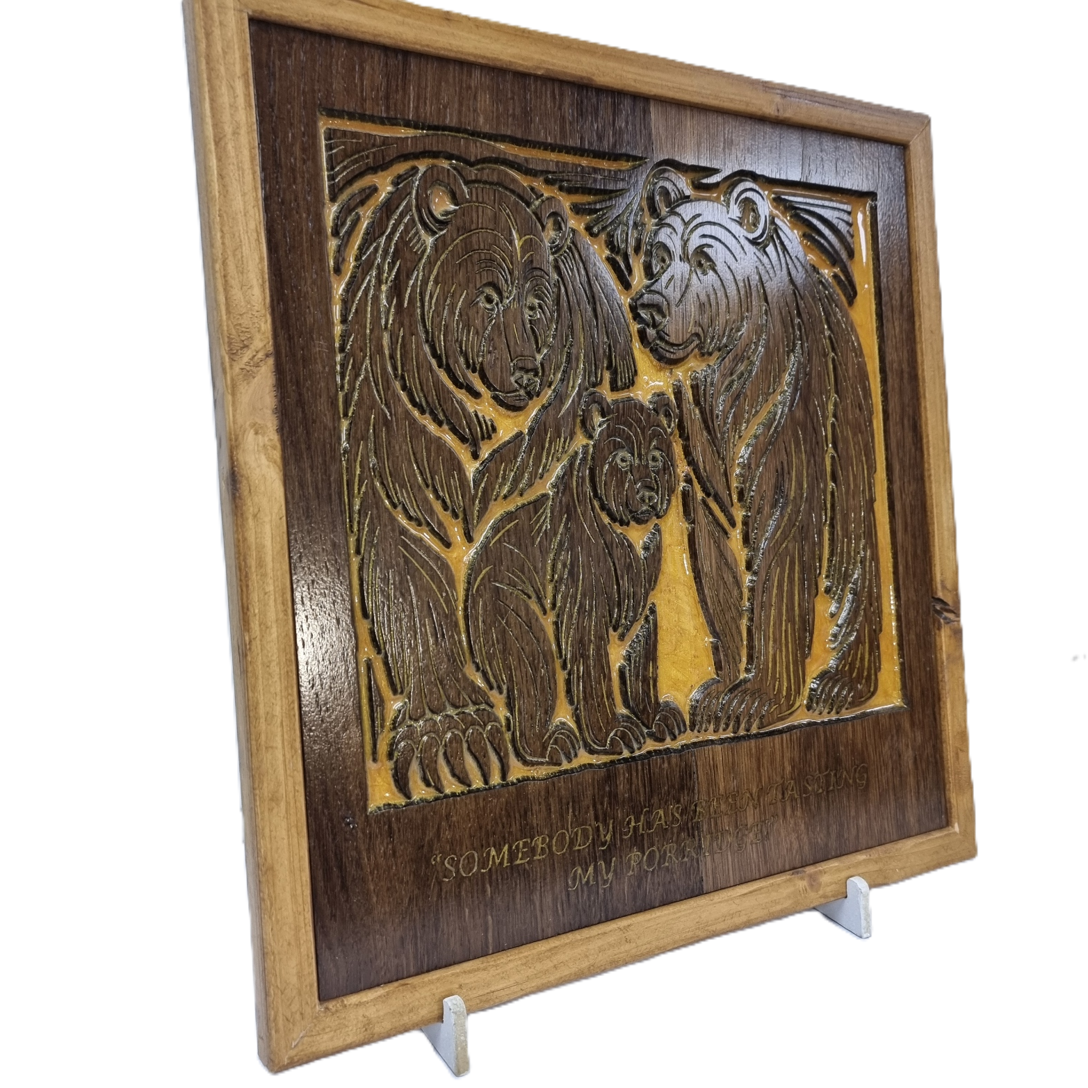Left angled view of reclaimed wood Three Bears carving with golden resin inlay.