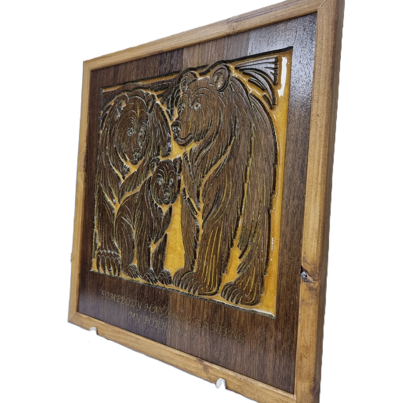 Right angled view of Three Bears wood carving with golden epoxy background.