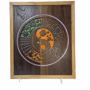 Geometric Yin Yang resin inlay carving shown from the front on reclaimed wood.