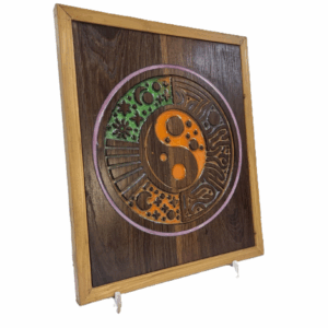 Left-angled photo of the Geometric Yin Yang resin carving highlighting the resin colours.