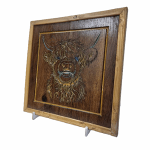 Right-angled view of rustic Highland cow wall art with resin inlay and wooden frame