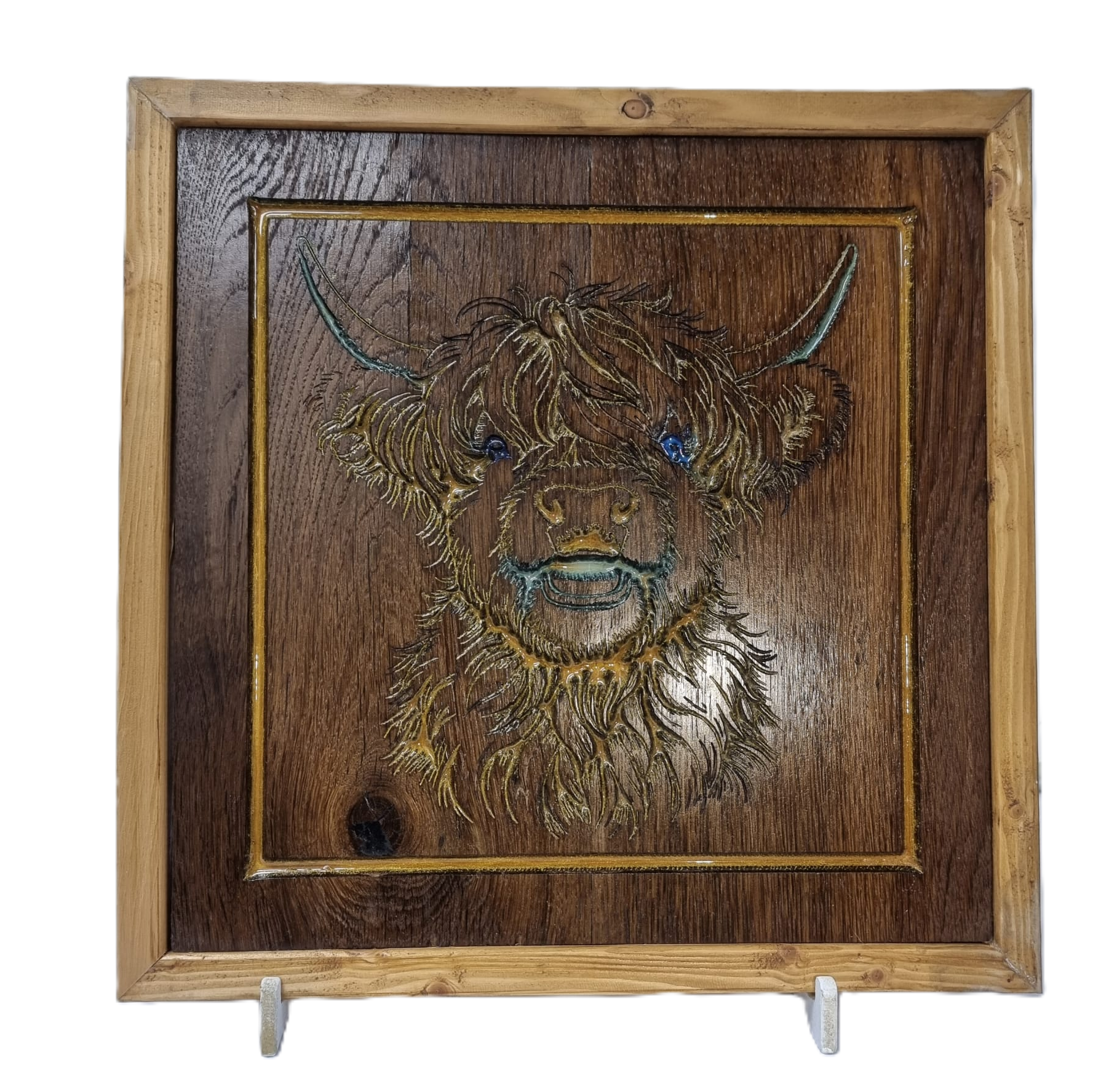 Front view of handcrafted Highland cow wood carving with resin inlay and rustic wooden frame