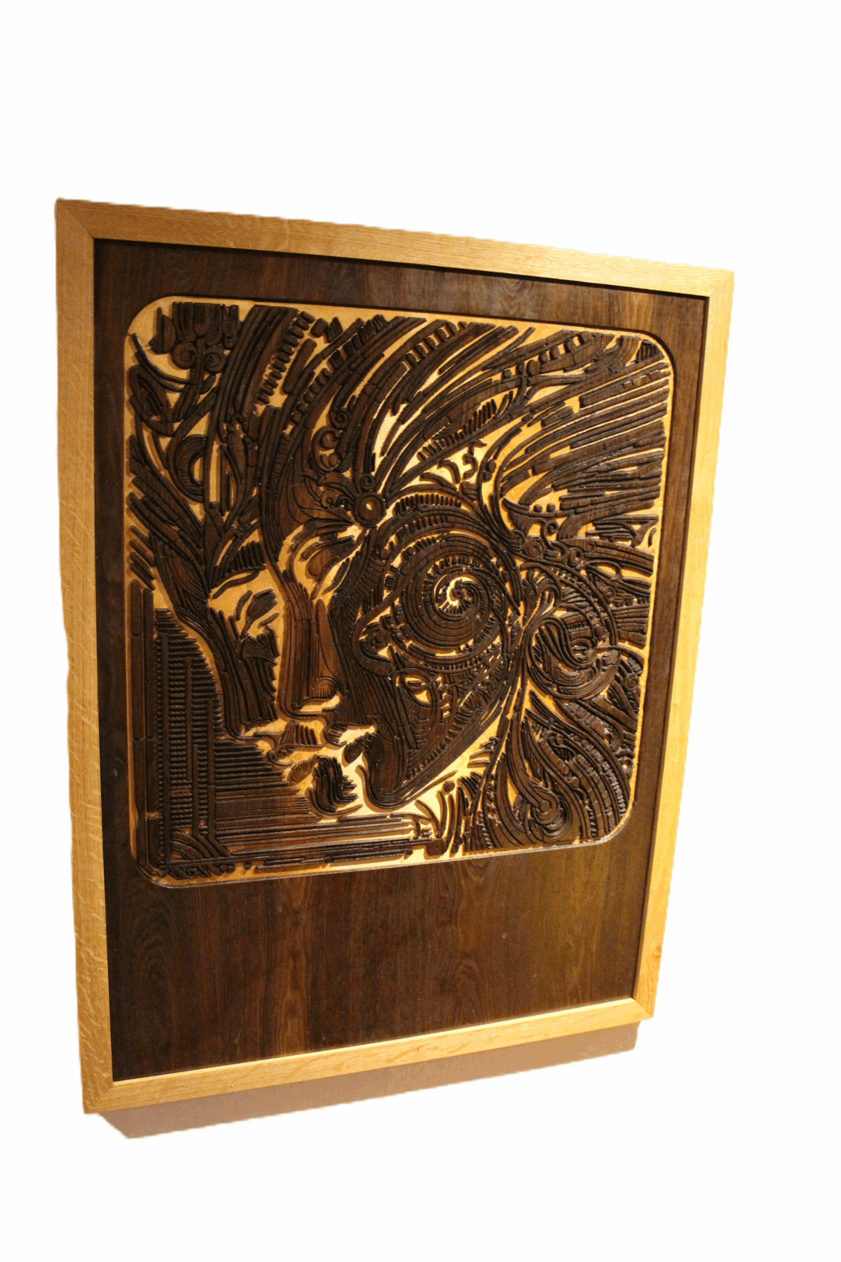 Angled view of The Enigmatic Harmony carved wood artwork showing detailed contours.