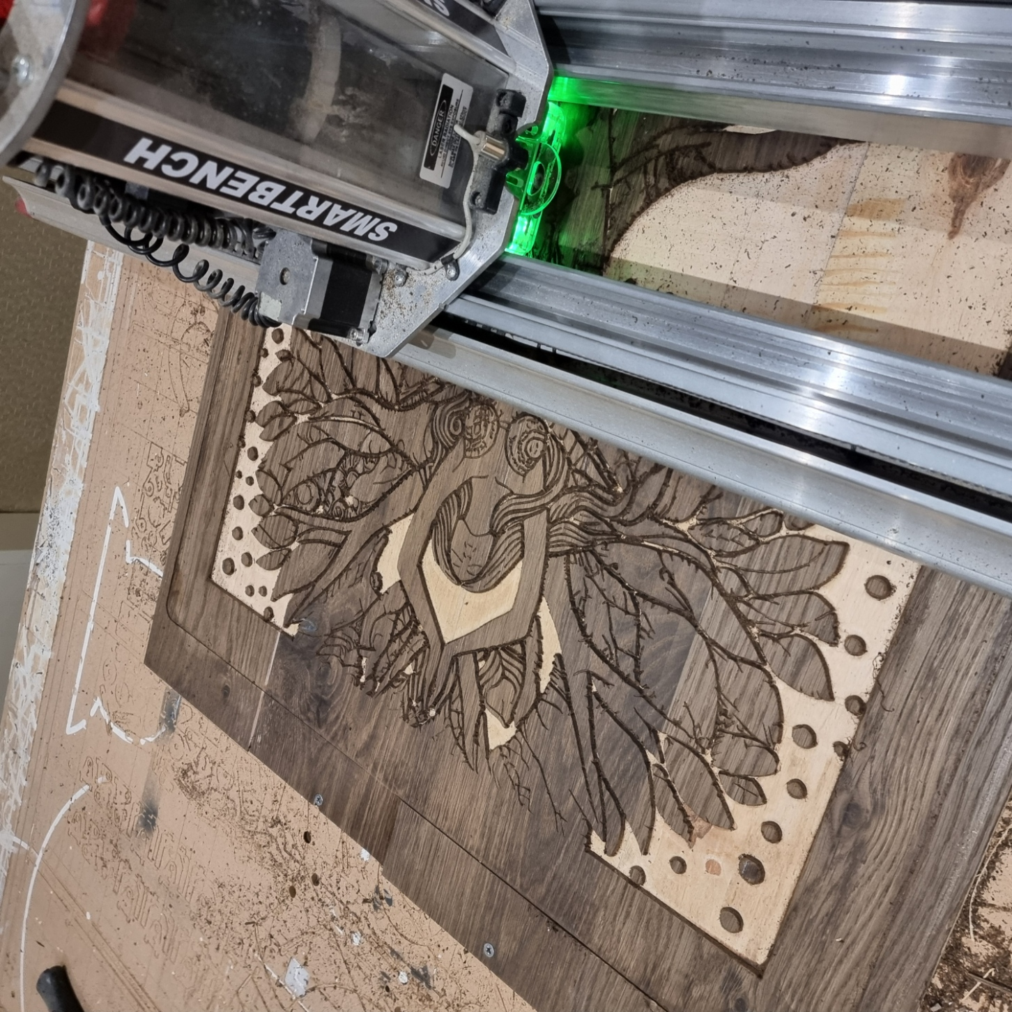 Woodland Echoes: The Tree of Serenity being carved on a Yeti SmartBench CNC machine, showing detailed linework and reclaimed wenge wood surface.