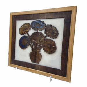 Right-side view of the reclaimed wood gerbera wall art with white resin background.
