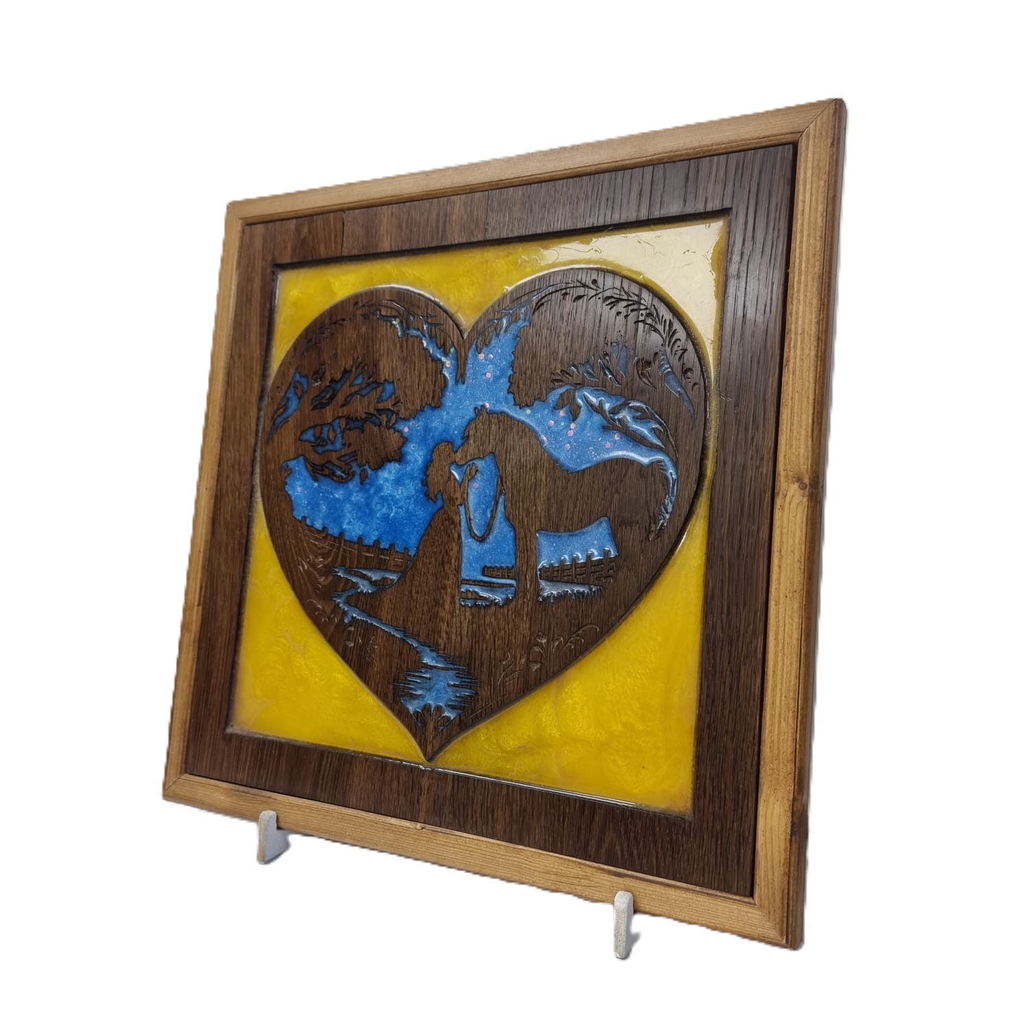 Right-side view of heart-shaped wood art featuring girl and horse with blue and yellow resin